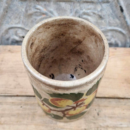 Old jam jar with apple or peach decoration