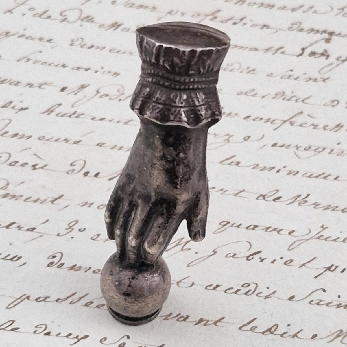 Antique "Victorian hand" office seal in silver-plated metal