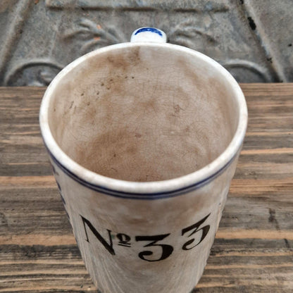 Chope d’archer n° 33 à décor bleu - Faïencerie de Nimy