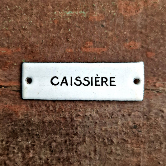ancienne plaque émaillée caissière