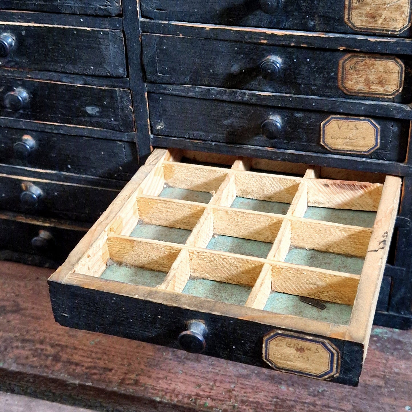 antique black watchmaker cabinet
