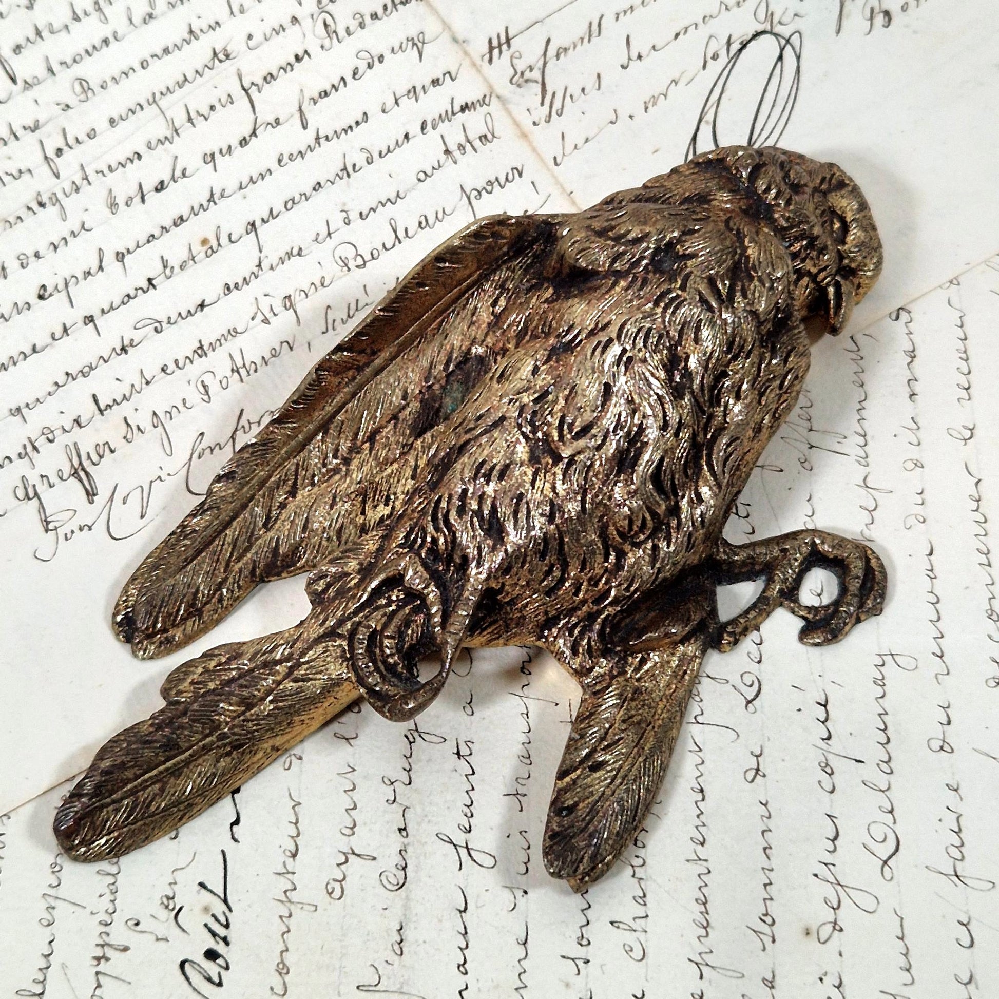 antique bronze dead bird