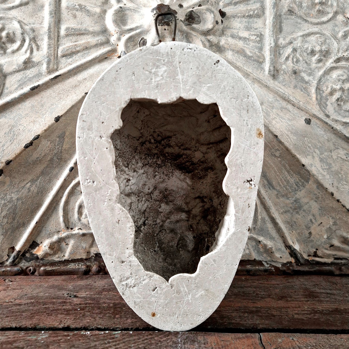 antique devil mask plaster wall