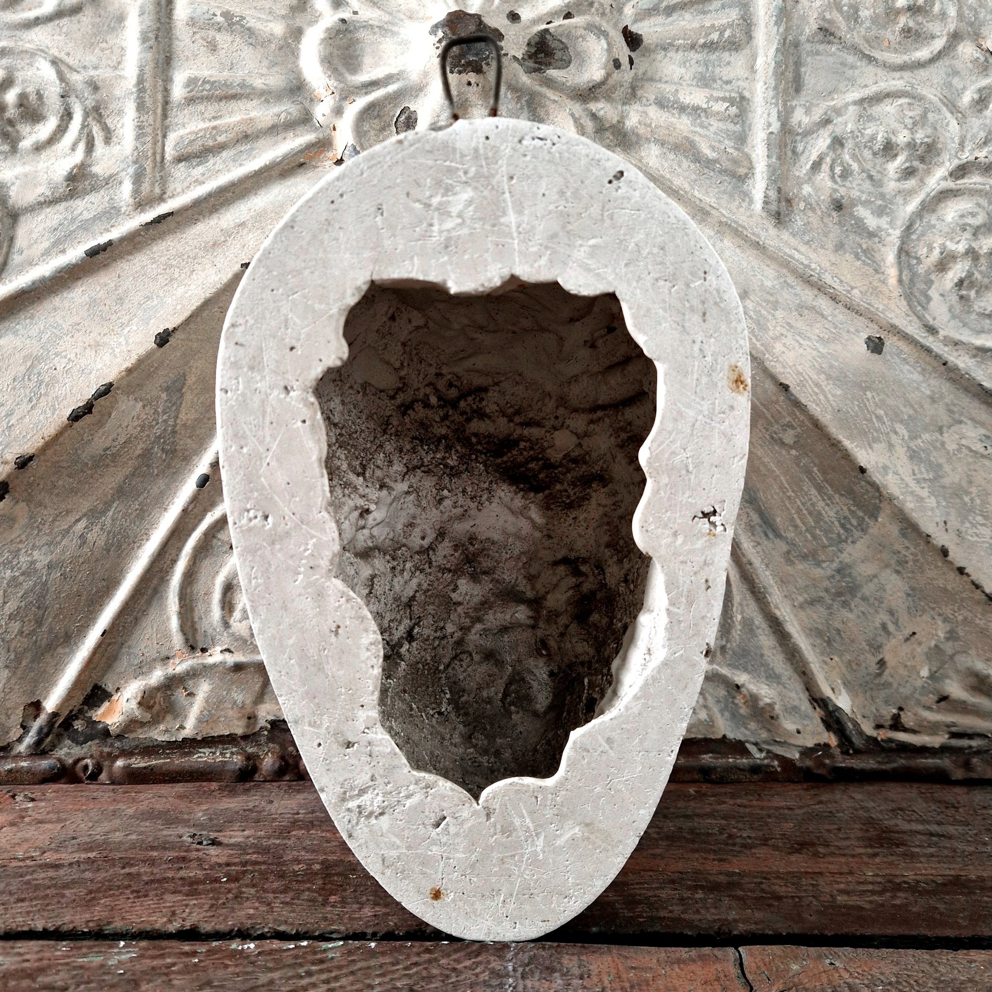 antique devil mask plaster wall