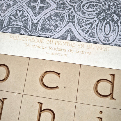 antique roman alphabet engraved