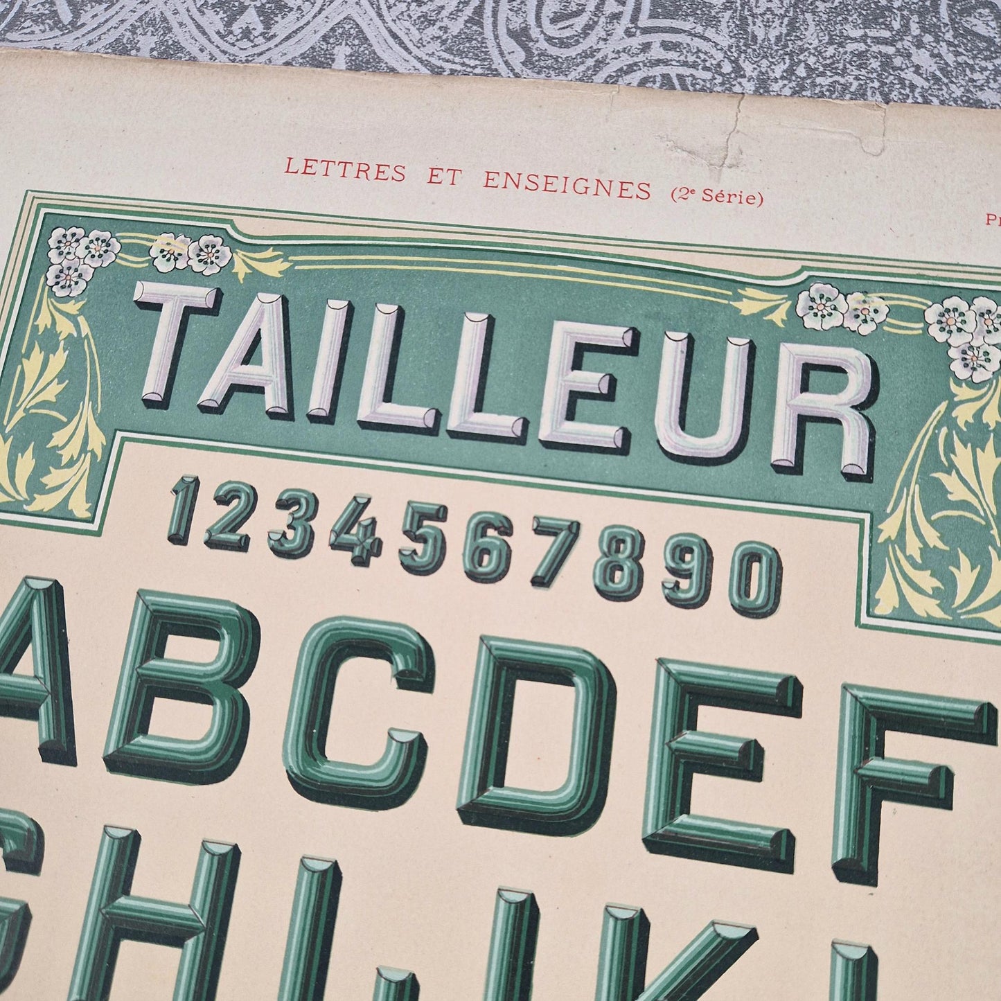 antique tailor lettering sign