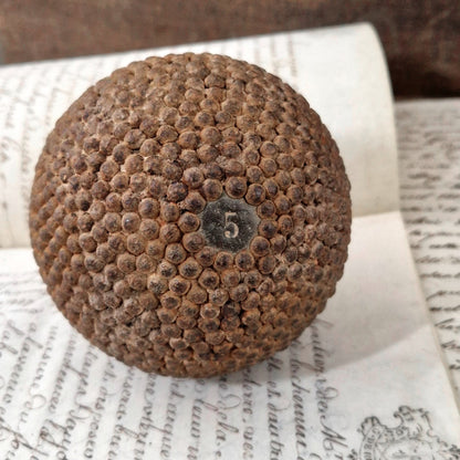 antique wooden nailed ball number 5