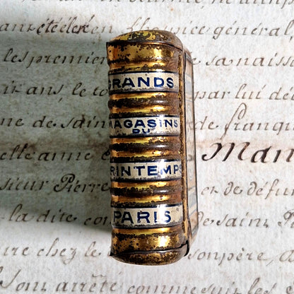 art nouveau lithographed book shaped tin