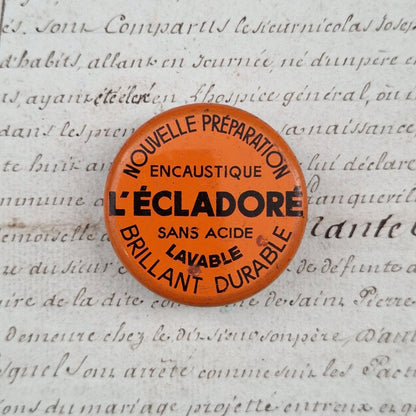 Petite boîte orange et noire « L’Écladoré - Encaustique »