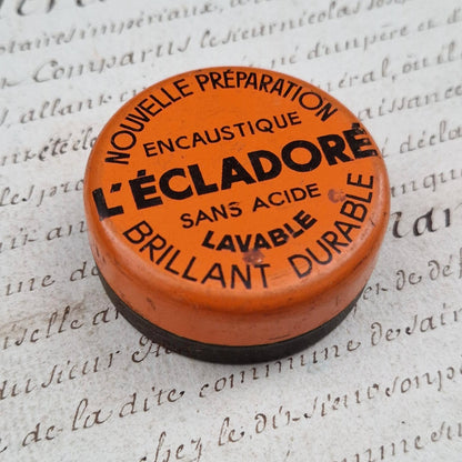 Petite boîte orange et noire « L’Écladoré - Encaustique »