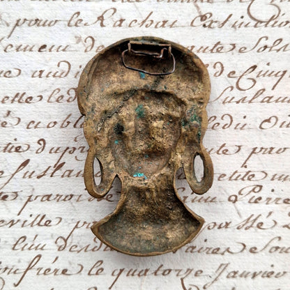 bronze female head ornament
