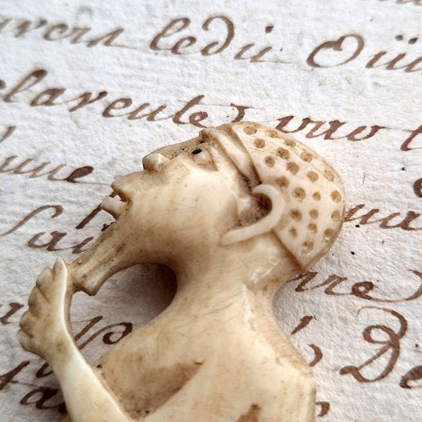 carved bone figurine prayer