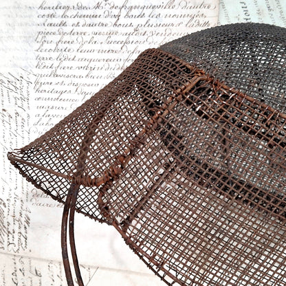 decorative fencing mask on wood stand