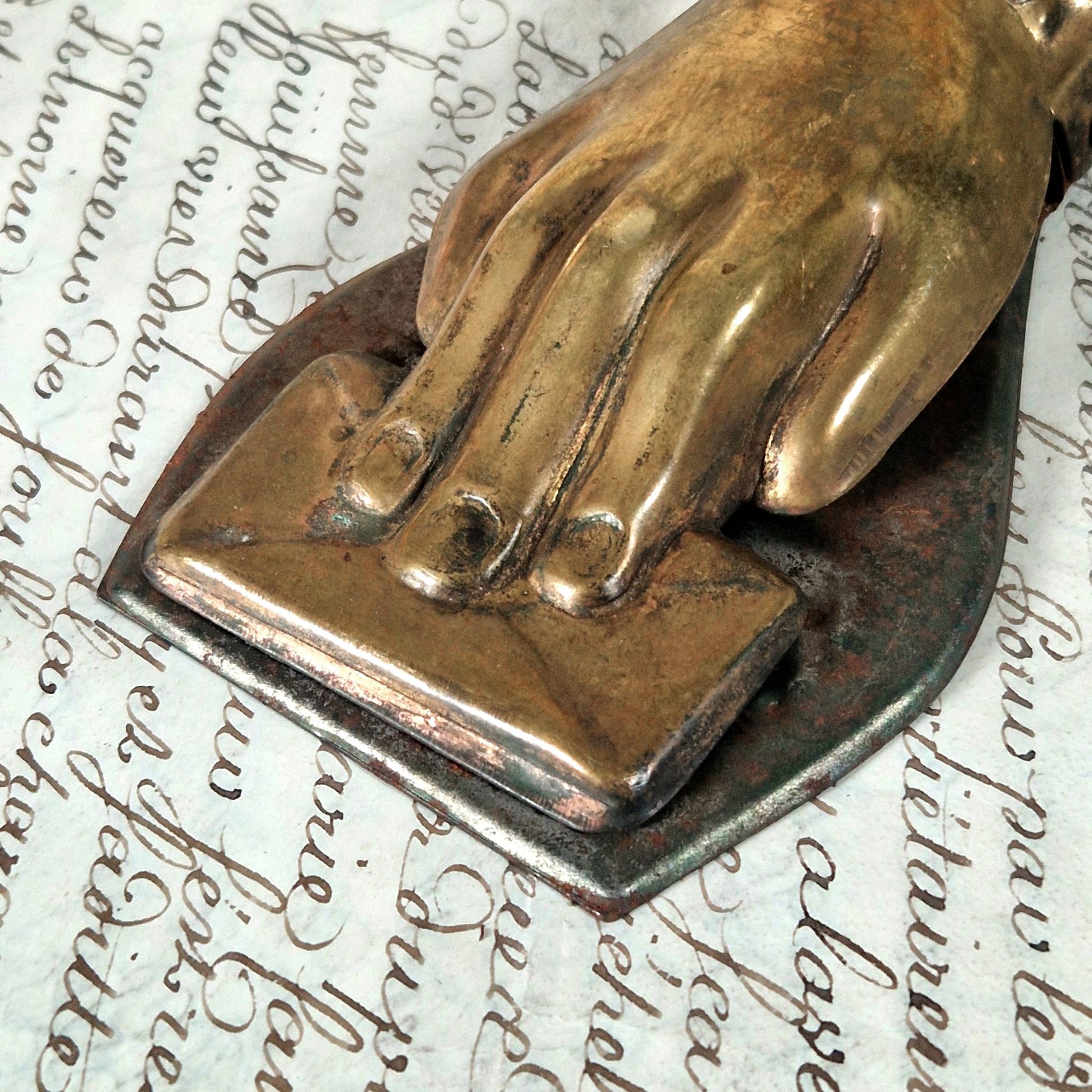 gilded metal hand envelope