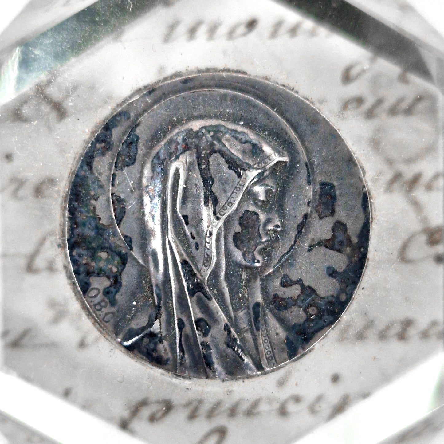 mary medallion in glass