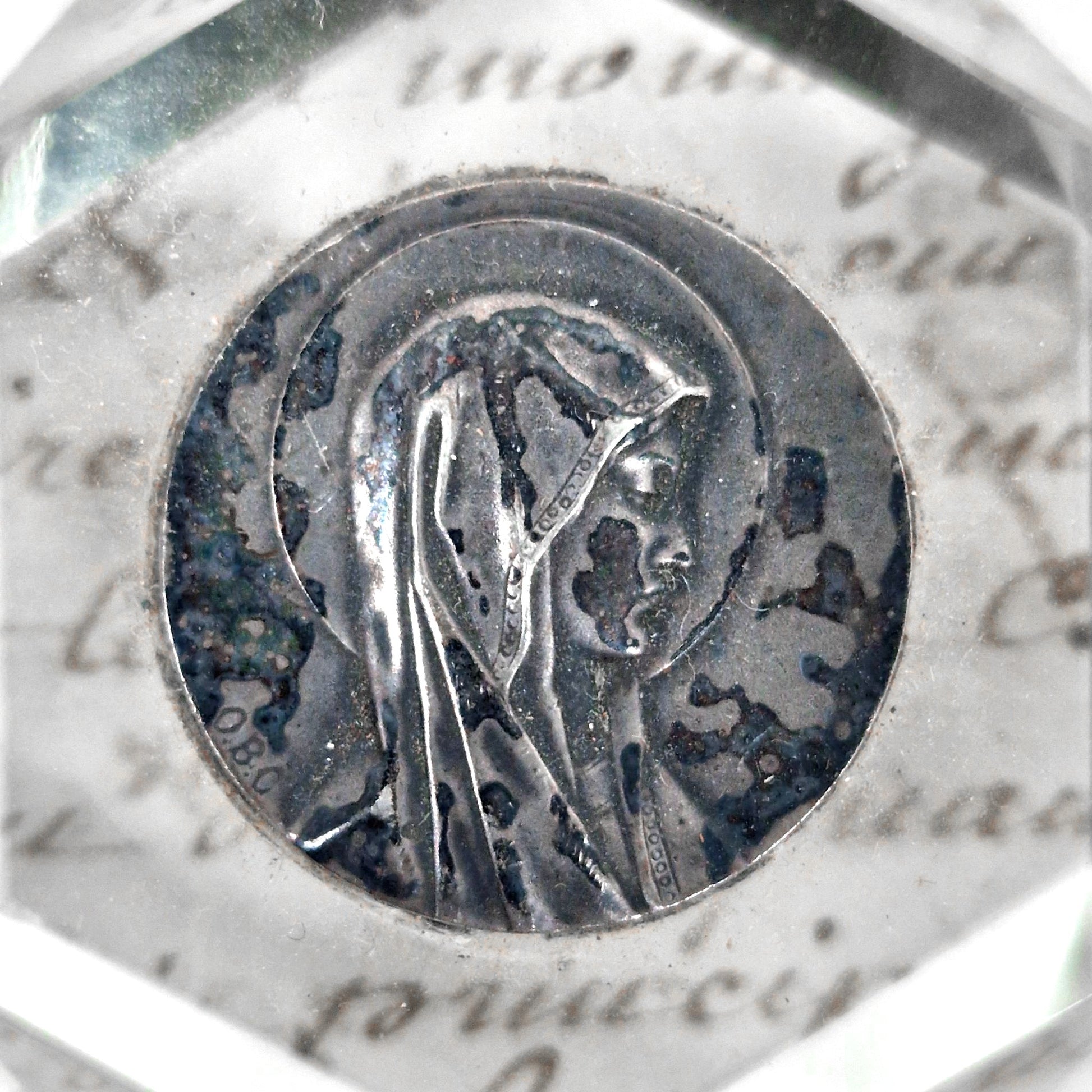 mary medallion in glass