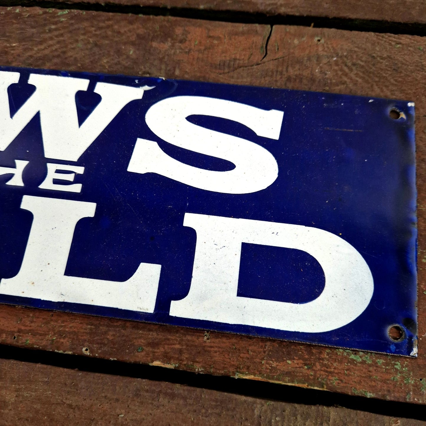 news of the world enamel sign