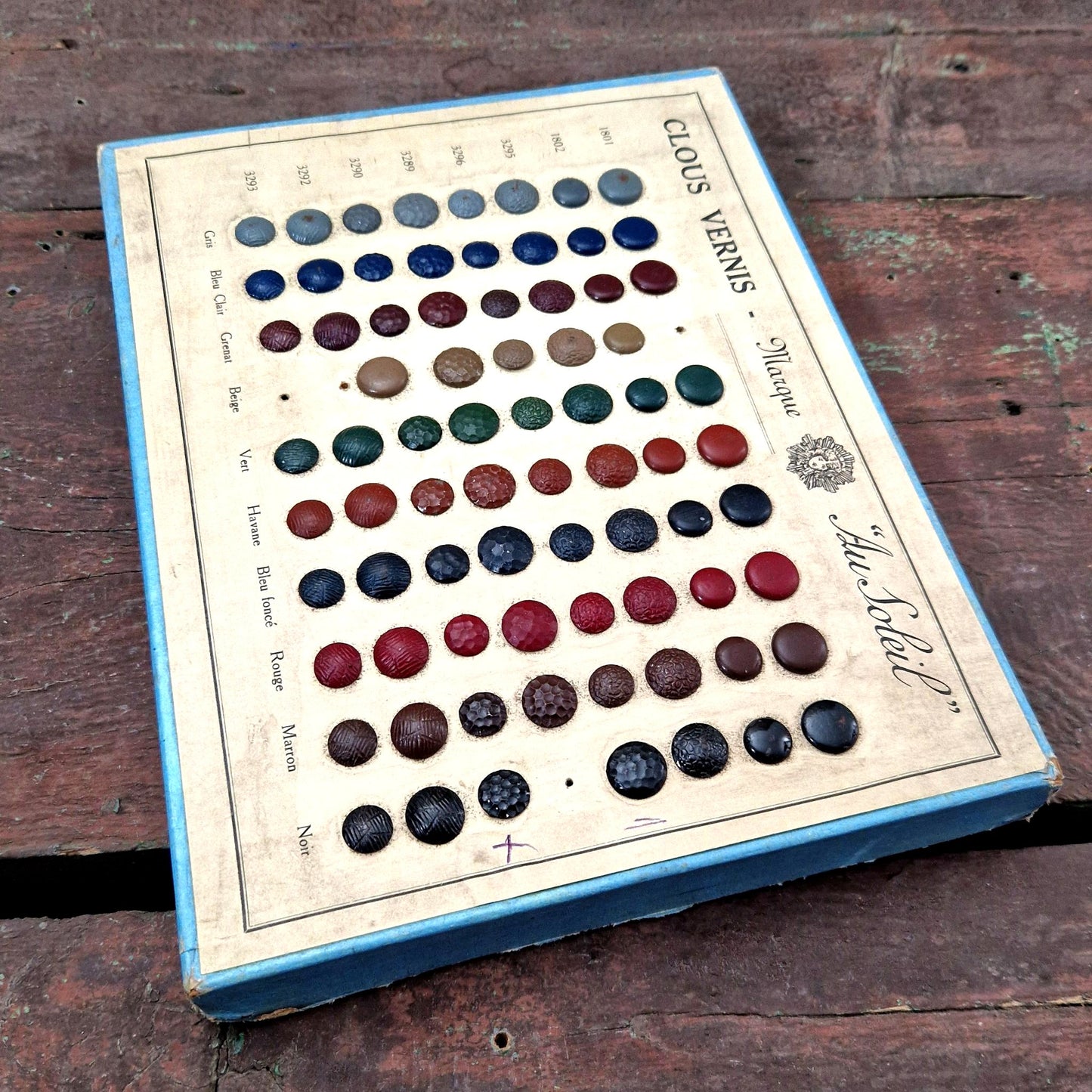 old cardboard sample board metal nails