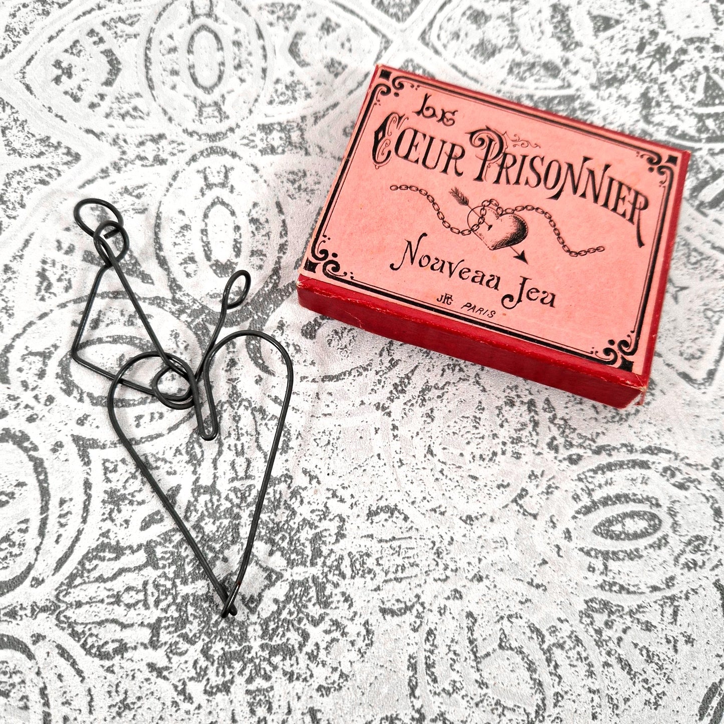 old heart cage brain teaser