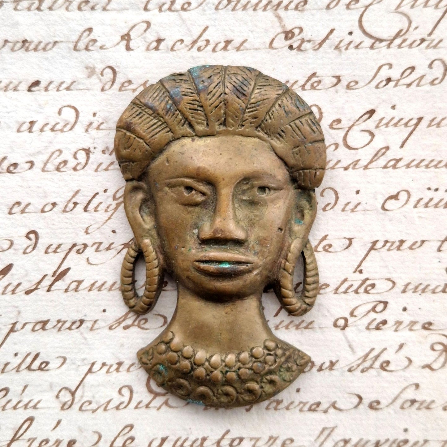 ornement en bronze tete de femme