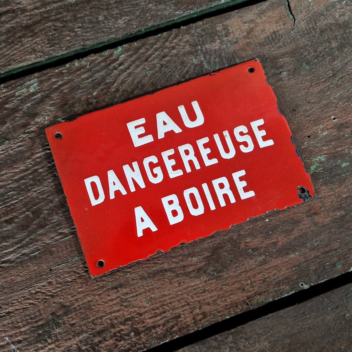Red enamel sign: "Water dangerous to drink"