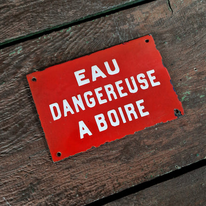 Red enamel sign: "Water dangerous to drink"