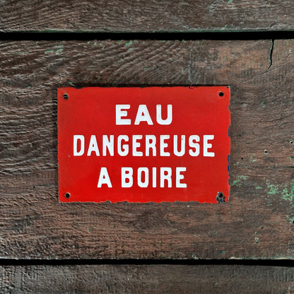 Red enamel sign: "Water dangerous to drink"