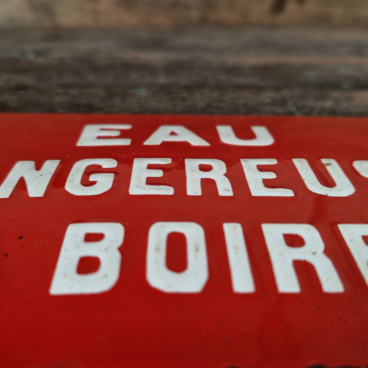 Red enamel sign: "Water dangerous to drink"