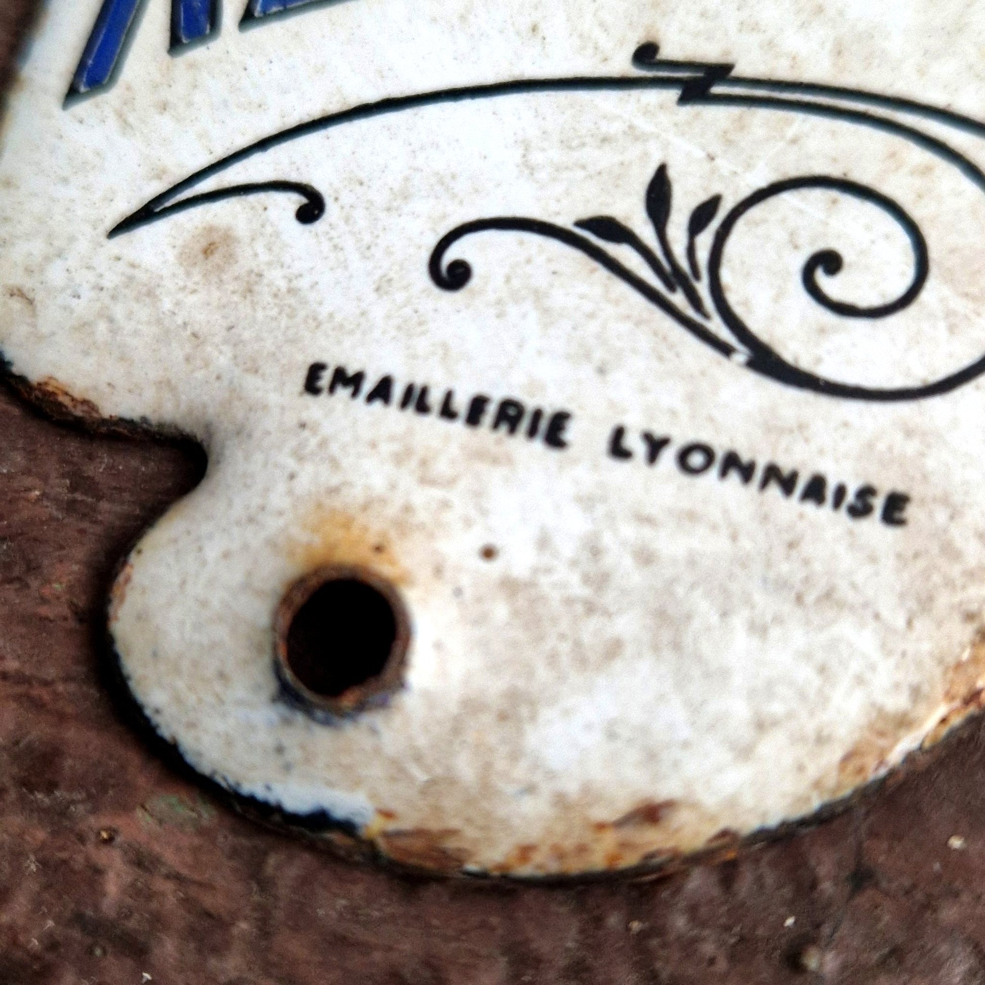 plaque publicitaire émaillée revillon