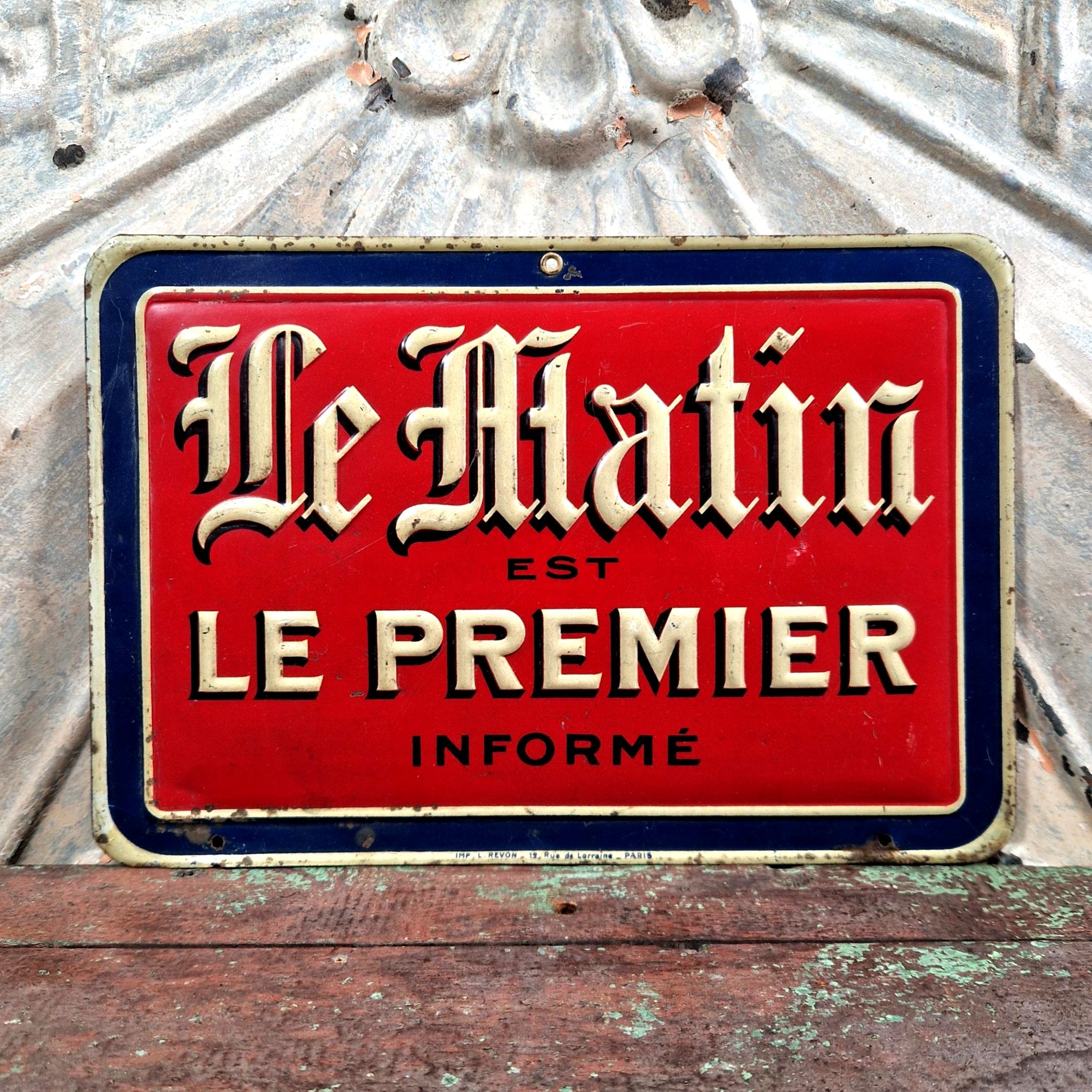 Advertising tin sign for the newspaper 