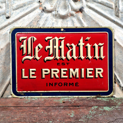 plaque publicitaire le matin
