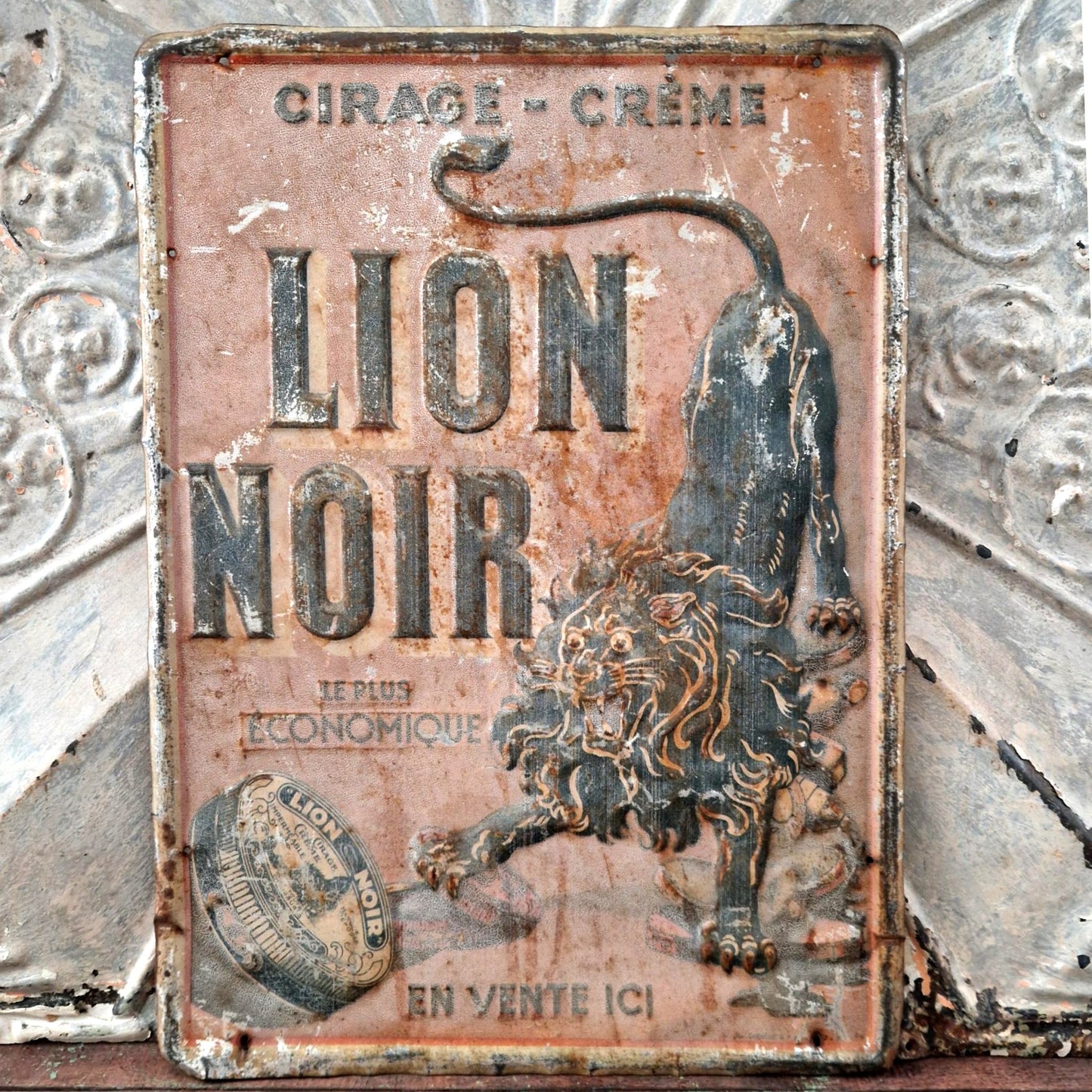 plaque publicitaire lion noir