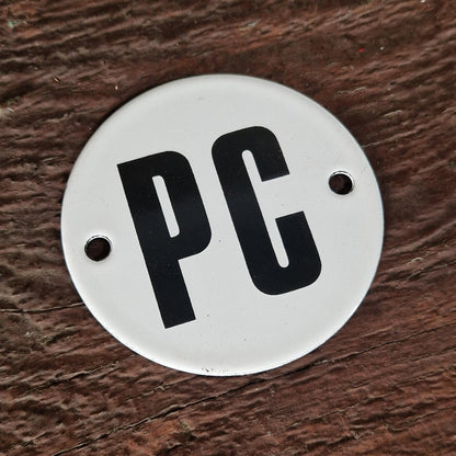 Round enamel sign "PC"