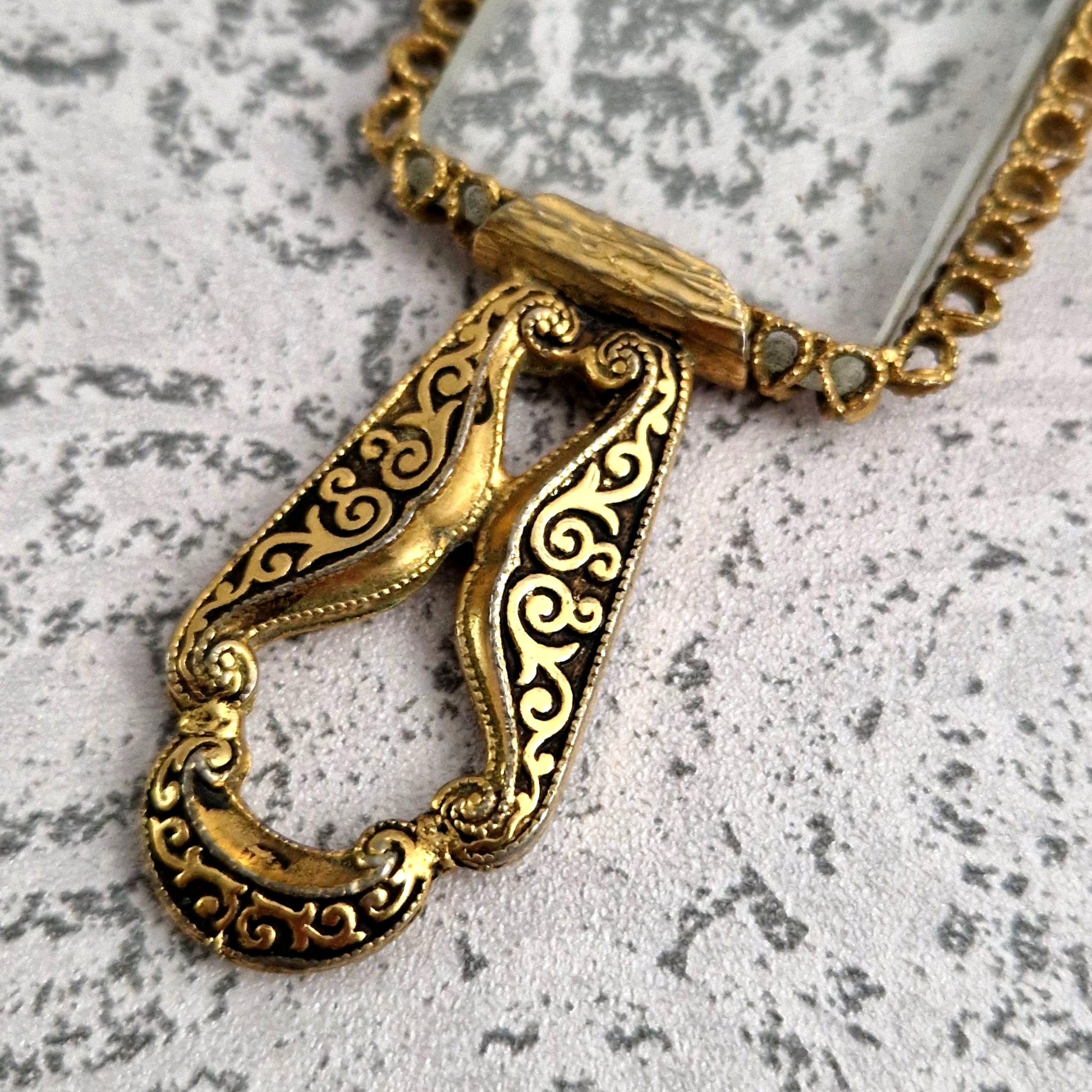 reading glass metal scrollwork