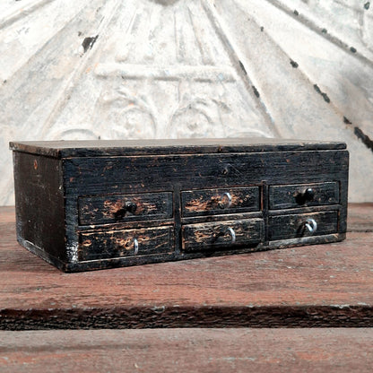 small black wooden drawer cabinet