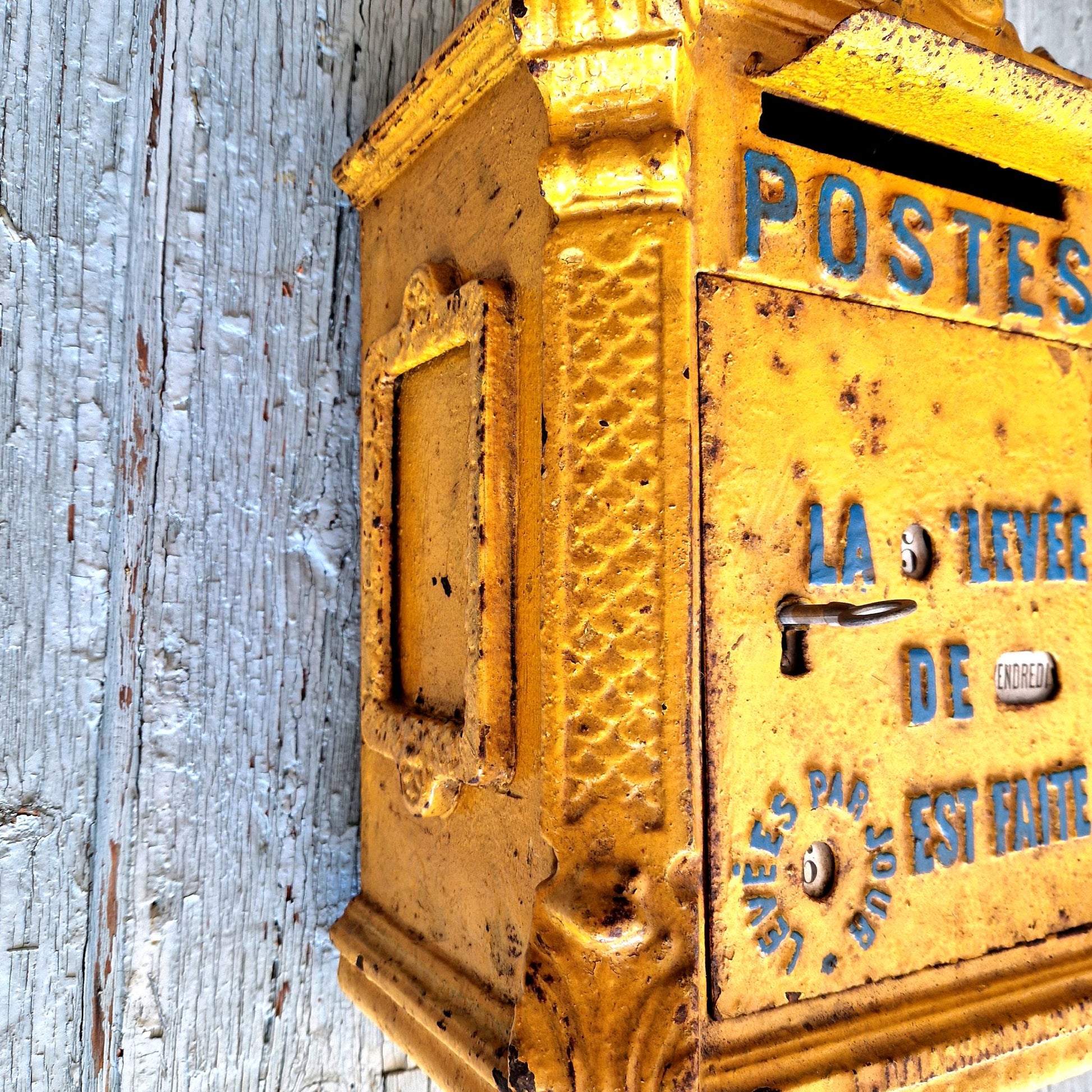 yellow french mailbox front